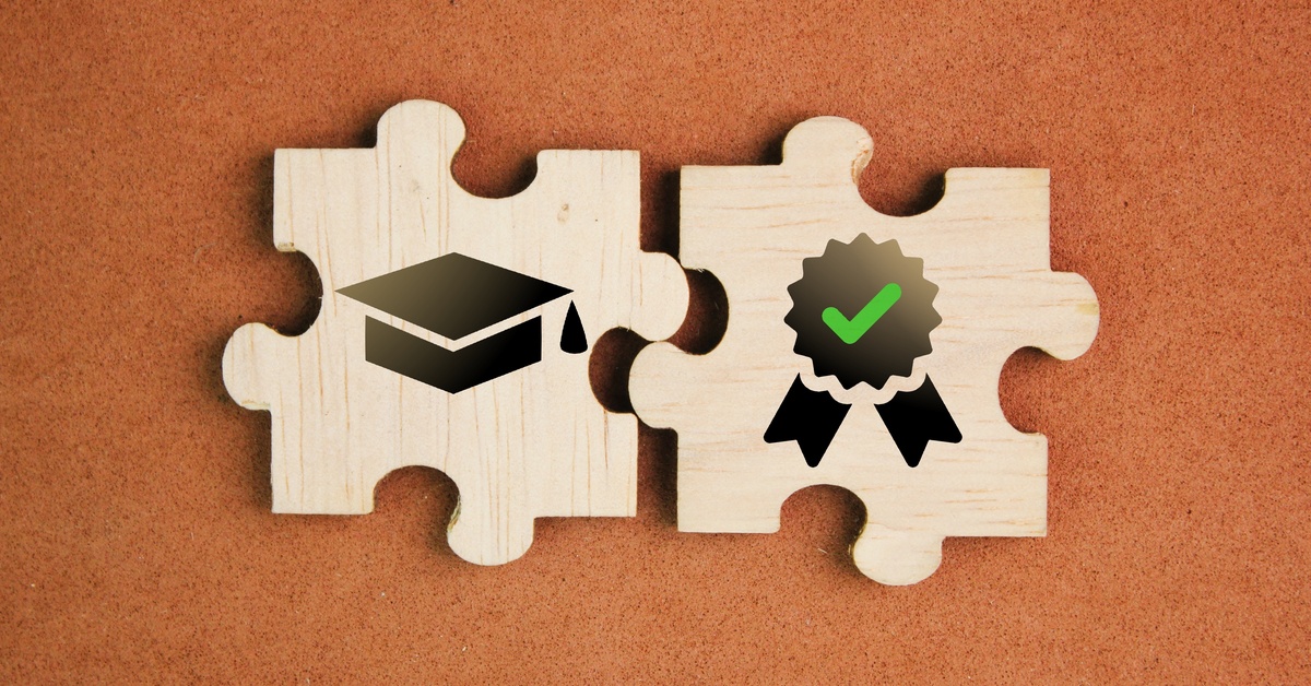 A puzzle piece with a graduation cap and another piece with a ribbon and check mark on it connect together.